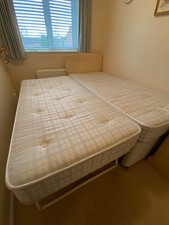 Single bed with guest pull