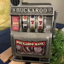 Vintage Toy Buckaroo Bank 8 1/2" Three Wheel One Arm Bandit Vegas Slot Machine