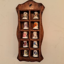 10 Vintage thimbles in wooden