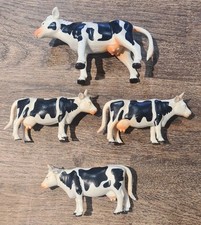 SET OF 4 PLASTIC COWS FARM