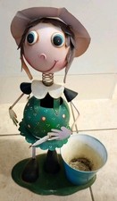 vintage metal garden ornament and Planter with wobbly head. Garden statue Decor.