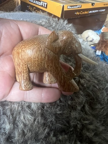 Hand carved wooden - hand, elephant