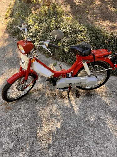 This honda moped bike - is,