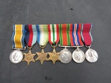 GROUP OF SEVEN WW1 / WW2 MINIATURES INCLUDING SWIVELLING BWM