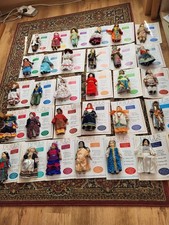 Porcelain 'Dolls of the World' in Traditional costumes - with magazines