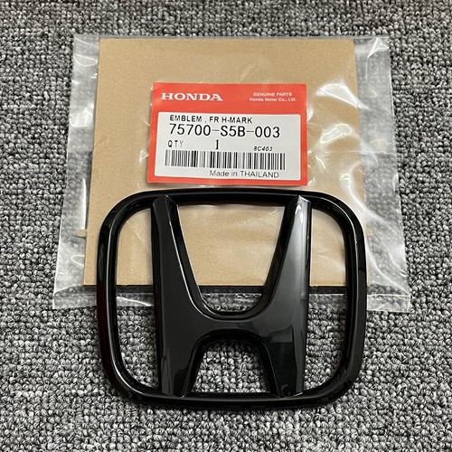 Front grille emblem - front,