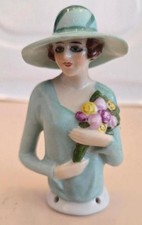 Unusual 1920s German half doll wearing hat holding flowers!