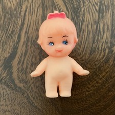 TINY KEWPIE TYPE DOLL WITH