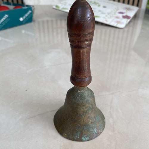 Vintage brass hand held school - hand,