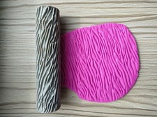 Textured rolling pin for