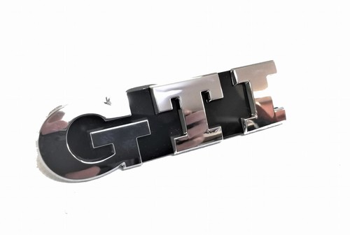 Genuine new front grille badge - front,