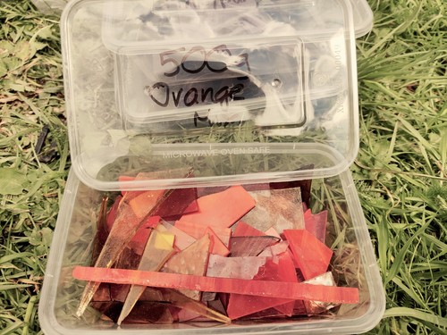 Orange stained glass offcuts - glass,