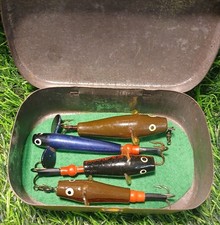 A Selection Of Four Vintage Devon Minnows In An Old Blackcurrant Pastel Tin.