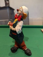 Italian clown holding his hat