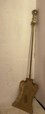 A vintage brass coal shovel