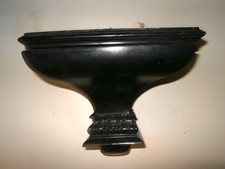 A EBONISED  WALL SHELF BRACKET