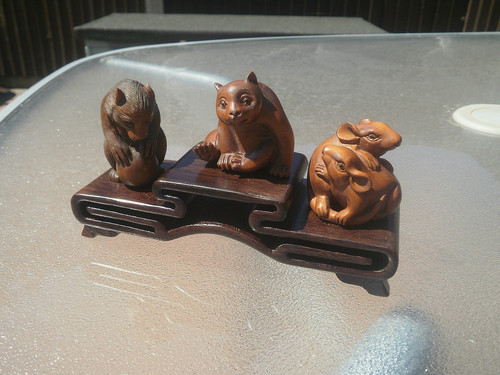 Carved ironwood tier stand - ironwood,