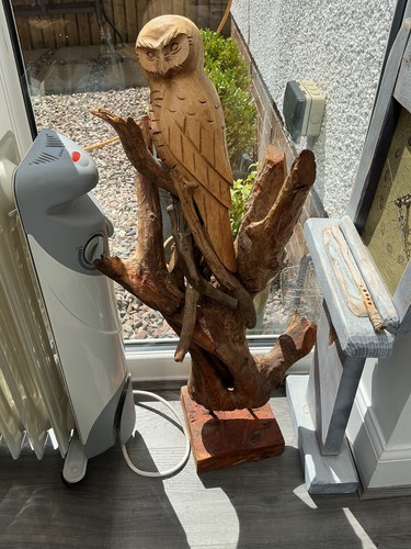 Large carved wooden owl - on, a