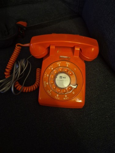 Vintage orange rotary phone - orange,