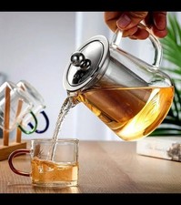 Glass 950ml Teapot Infuser with Silver Candle Warmer & 10 small pink candle's.