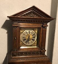 19th century German striking clock in a dark oak case