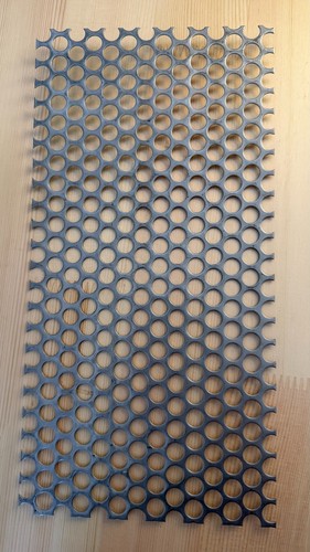 Perforated sheet metal with - , a