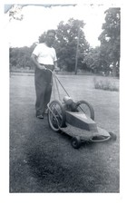1940s Man Pushing Antique Lawn