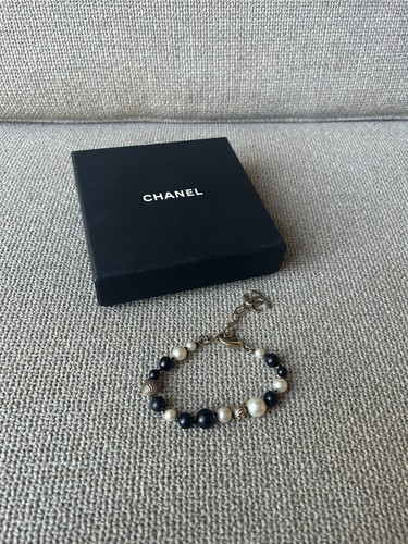 Chanel black and - and, pearl
