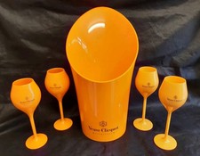 VEUVE CLICQUOT CHAMPAGNE ORANGE ACRYLIC ICE BUCKET & FOUR CHAMPAGNE FLUTES 