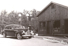 Grayling Wakalers Corner Store Michigan RPPC Postcard Nehi Coca Cola Gas Pumps