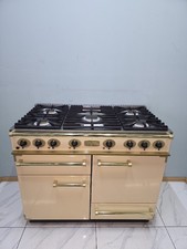FALCON 110CM DUAL FUEL RANGE COOKER IN CREAM AND BRASS.  Ref--ED298