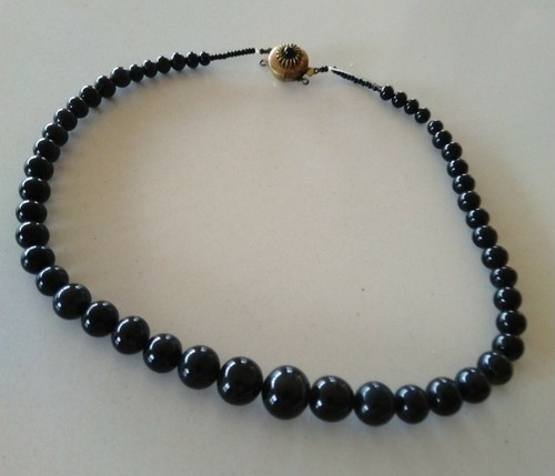 Old black glass granduated - glass,