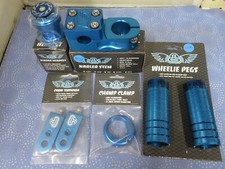 SE Bikes BMX Mix Lot-Pegs, Narler, Eluder Headset, Champ Clamp, Tensioner - Blue