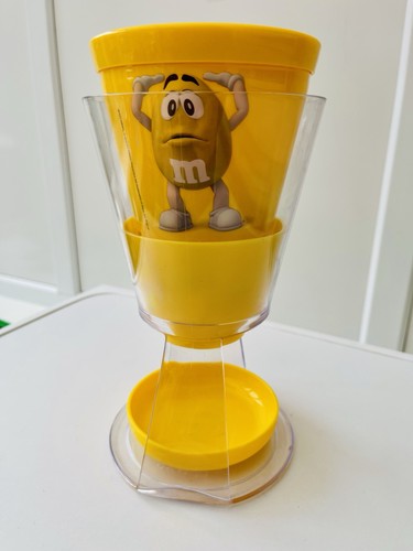 Yellow candy dispenser - m&m’s,
