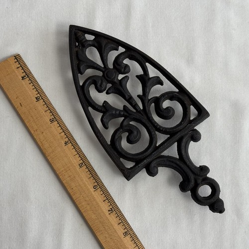 Vtg sad iron trivet - sad,