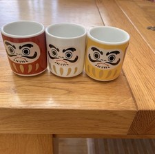 Three egg cups red - egg, white