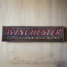 Winchester Cartridges And Guns Cast Iron Plaque With Antique Finish (13.5" x 3")