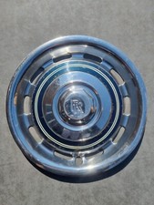 One Rolls Royce vented chrome wheel trim with blue and cream pin striped ring.