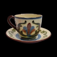 Motto Ware Cup and Saucer