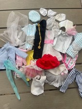bundle of vintage Barbie clothes