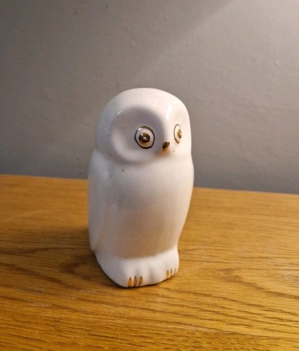 White porcelain owl figurine.
