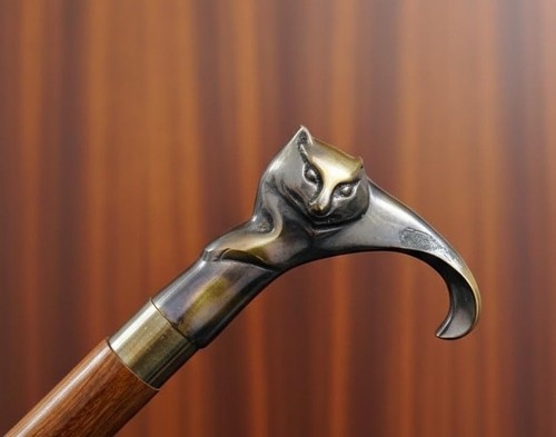 Brass cat head - head, stick