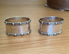 PAIR OF ANTIQUE SILVER ADIE BROS NAPKIN RINGS WITH CELTIC BAND BIRMINGHAM 1949