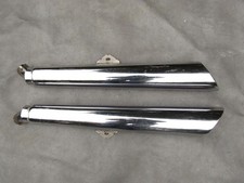 A PAIR OF GENUINE TRIUMPH THUNDERBIRD EXHUAST MUFFLERS 2203120 AND 2203110