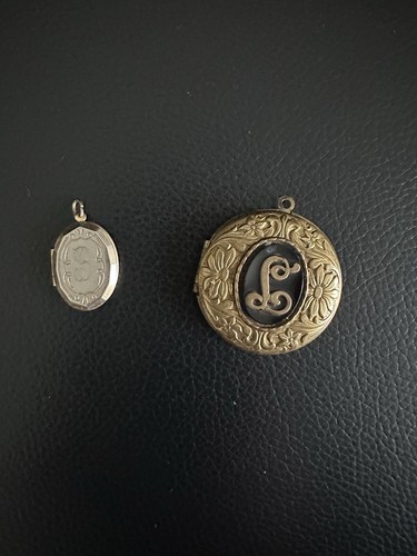 Two antique gold tone lockets - two,