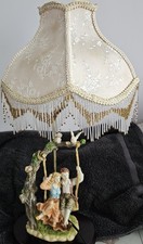 The Juliana Collection Couple On A Tree Swing Table Lamp