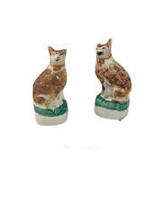 Antique pottery cats