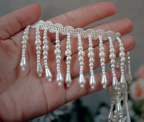 Dangling ivory tassel beaded - dangling,