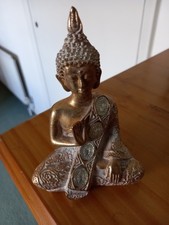 Small buddha statue gold and