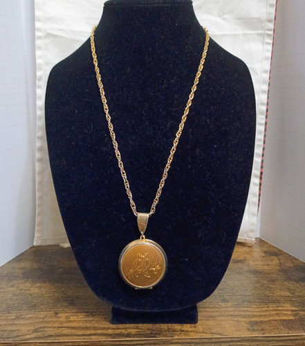 Antique locket engraved with - engraved,